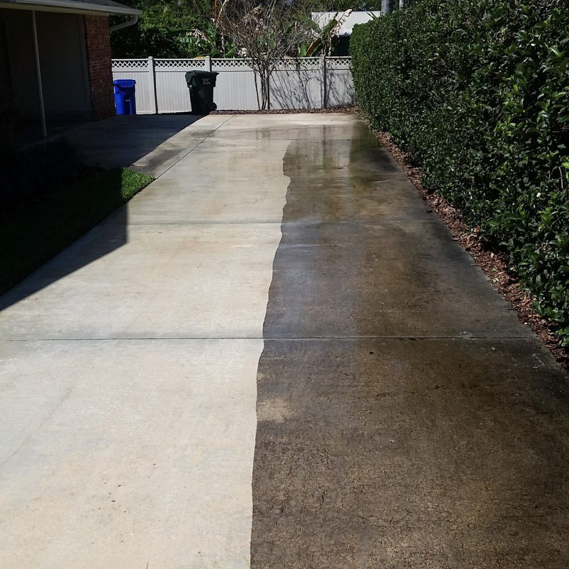 A before and after photo of a concrete driveway pressure washed by Melo Powerwashing & Painting in linwood, nj