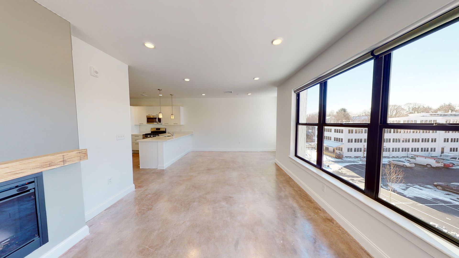 The overlook Unfurnished living room with open kitchen and large windows