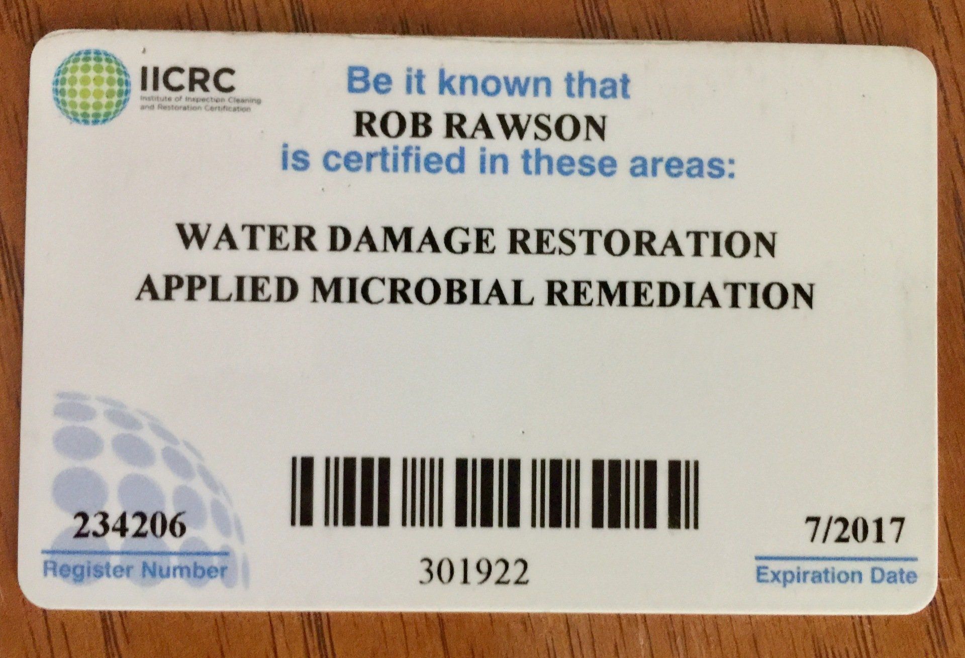 A white iicrc card that says rob rawson is certified in these areas