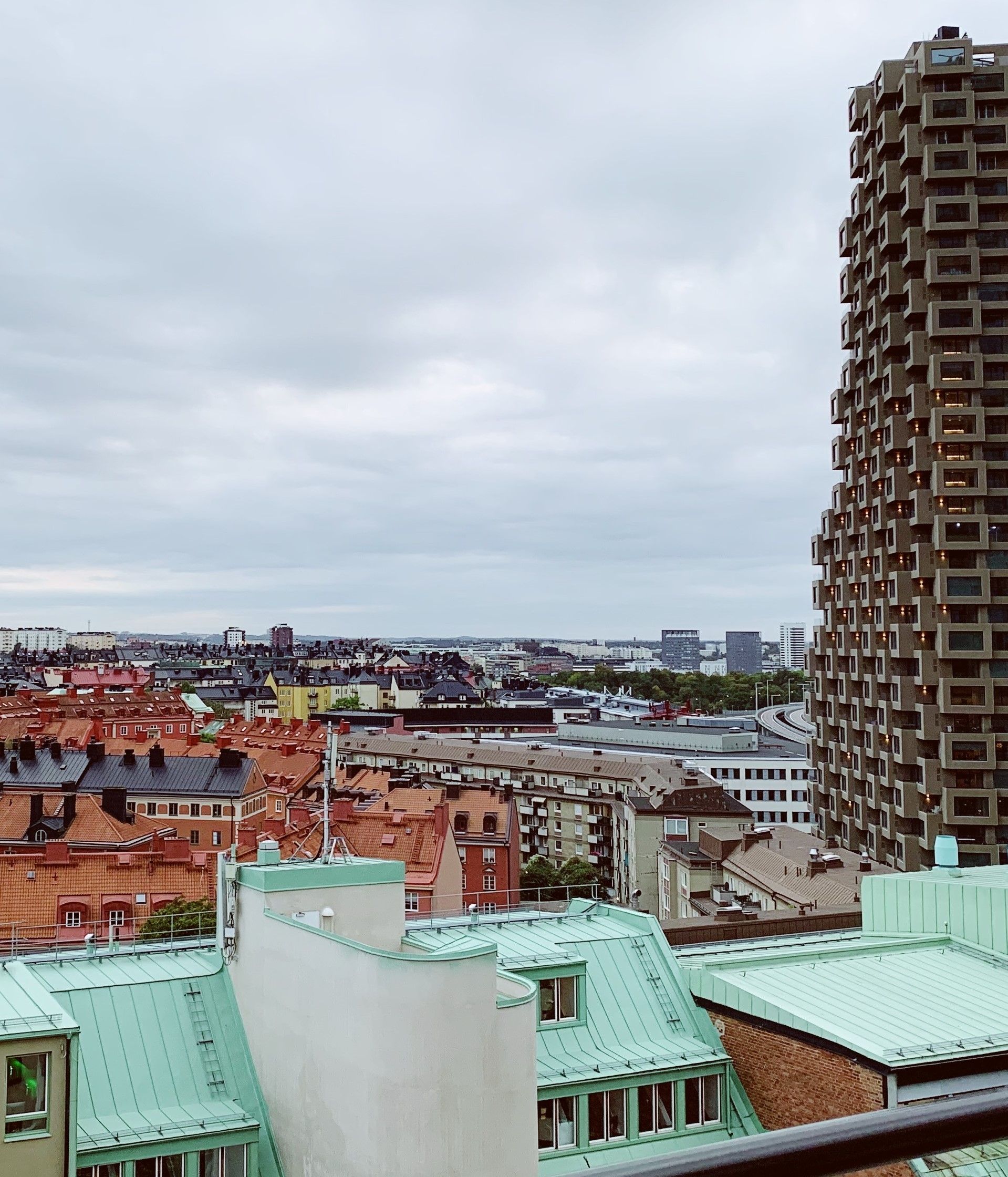 A view of the Stockholm skyline with its lovely fooftops on a cloudy day.