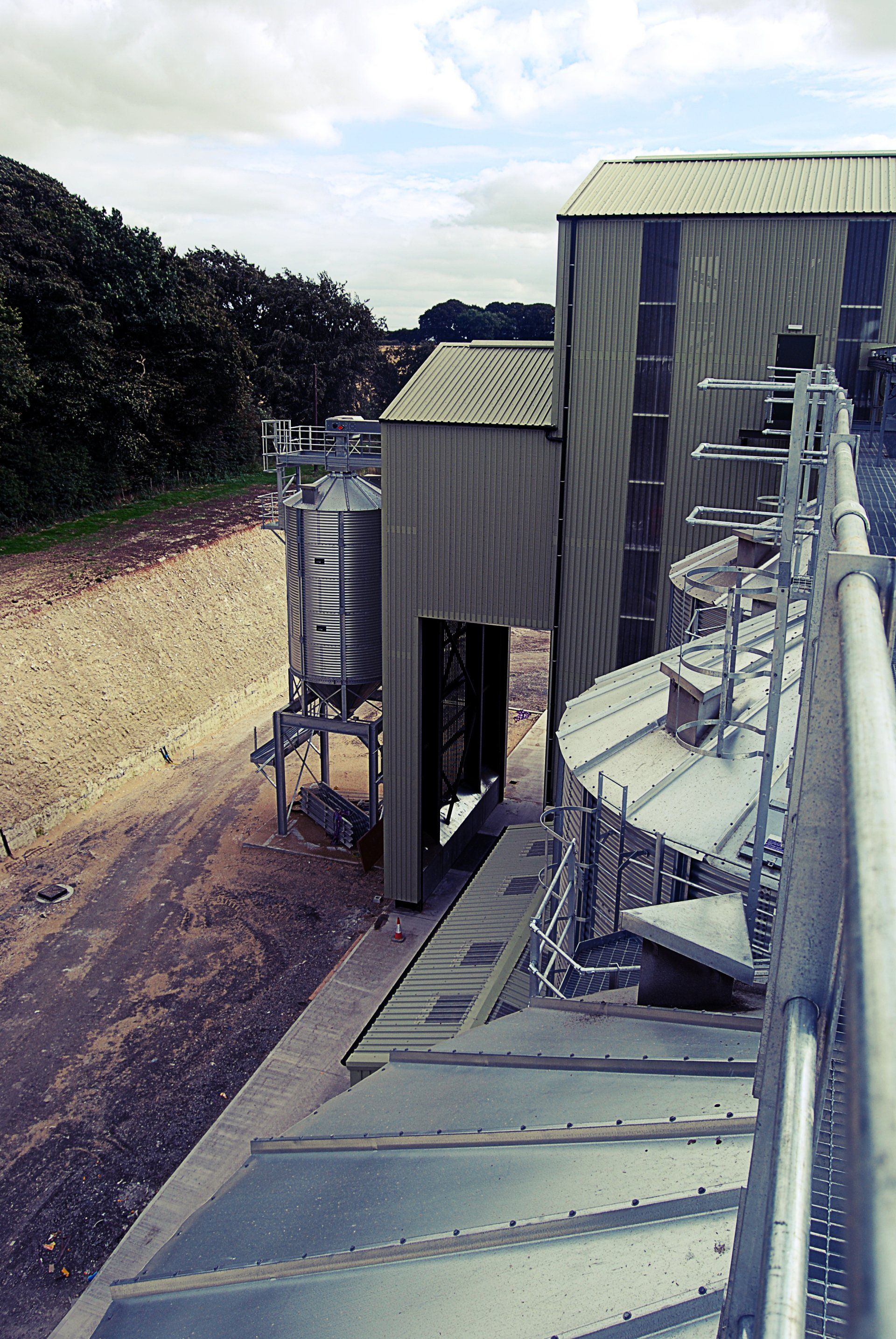 An aerial view of a factory with stairs leading up to it