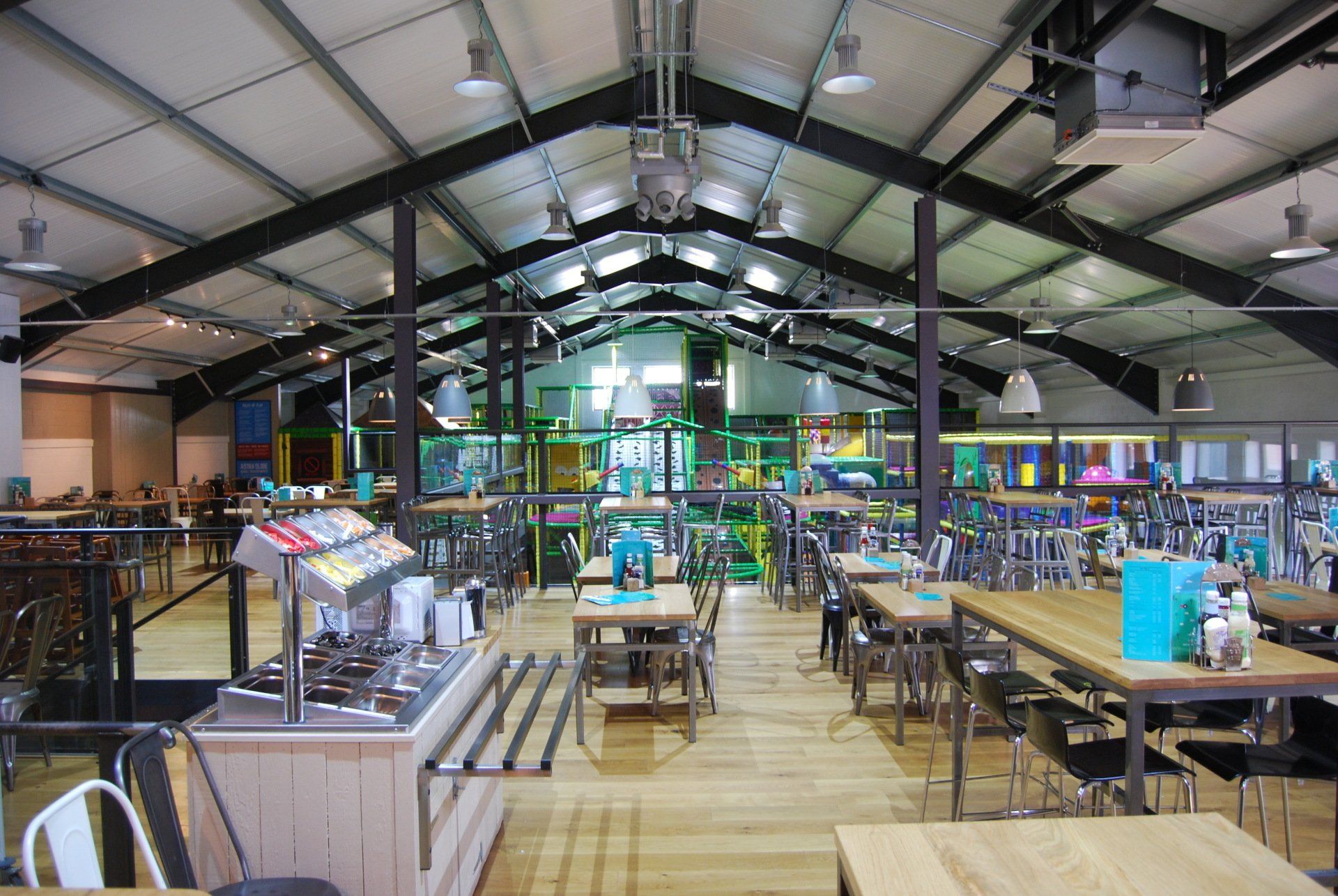 A large room with tables and chairs in it