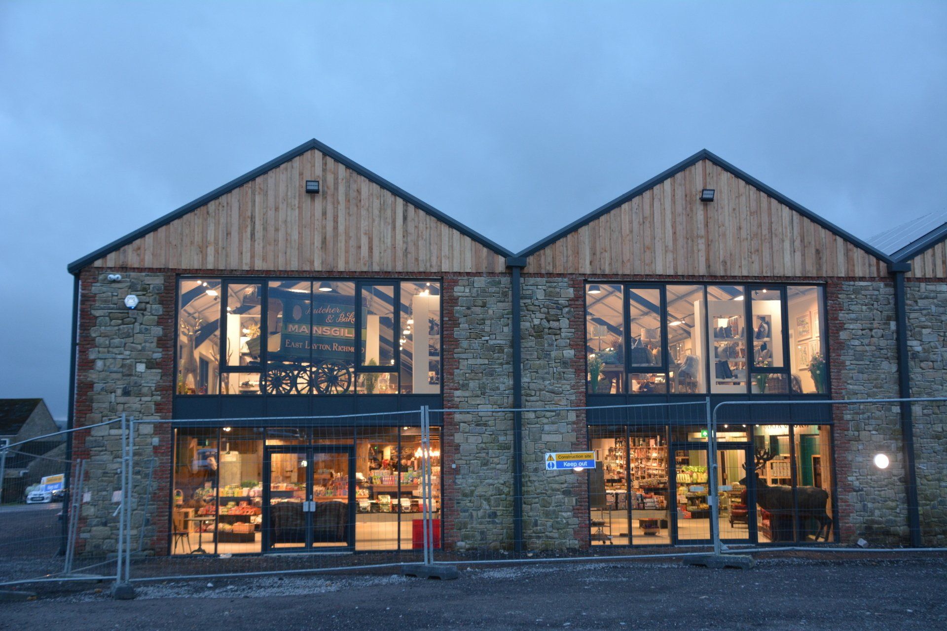 A large building with a lot of windows and a wooden roof.
