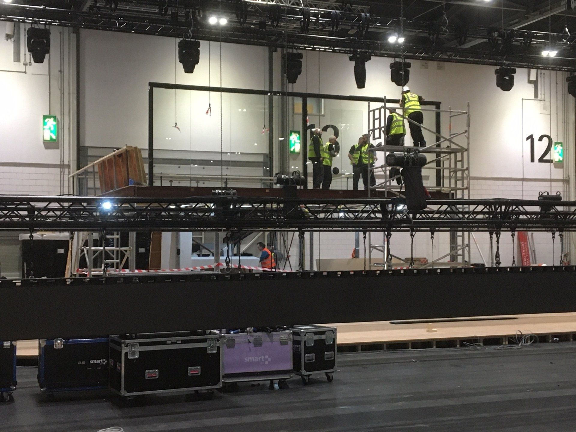 The number 12 is on the wall above the stage