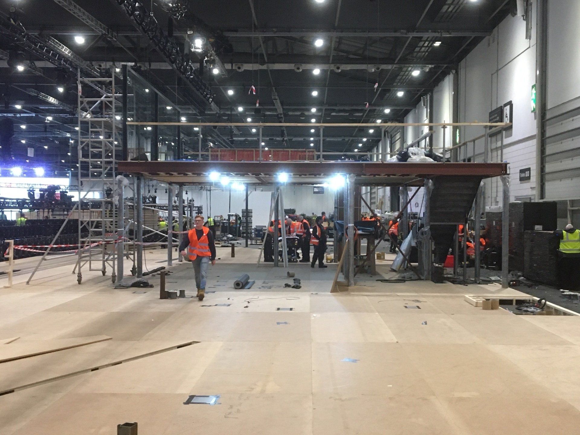 A group of people are working on a large building.