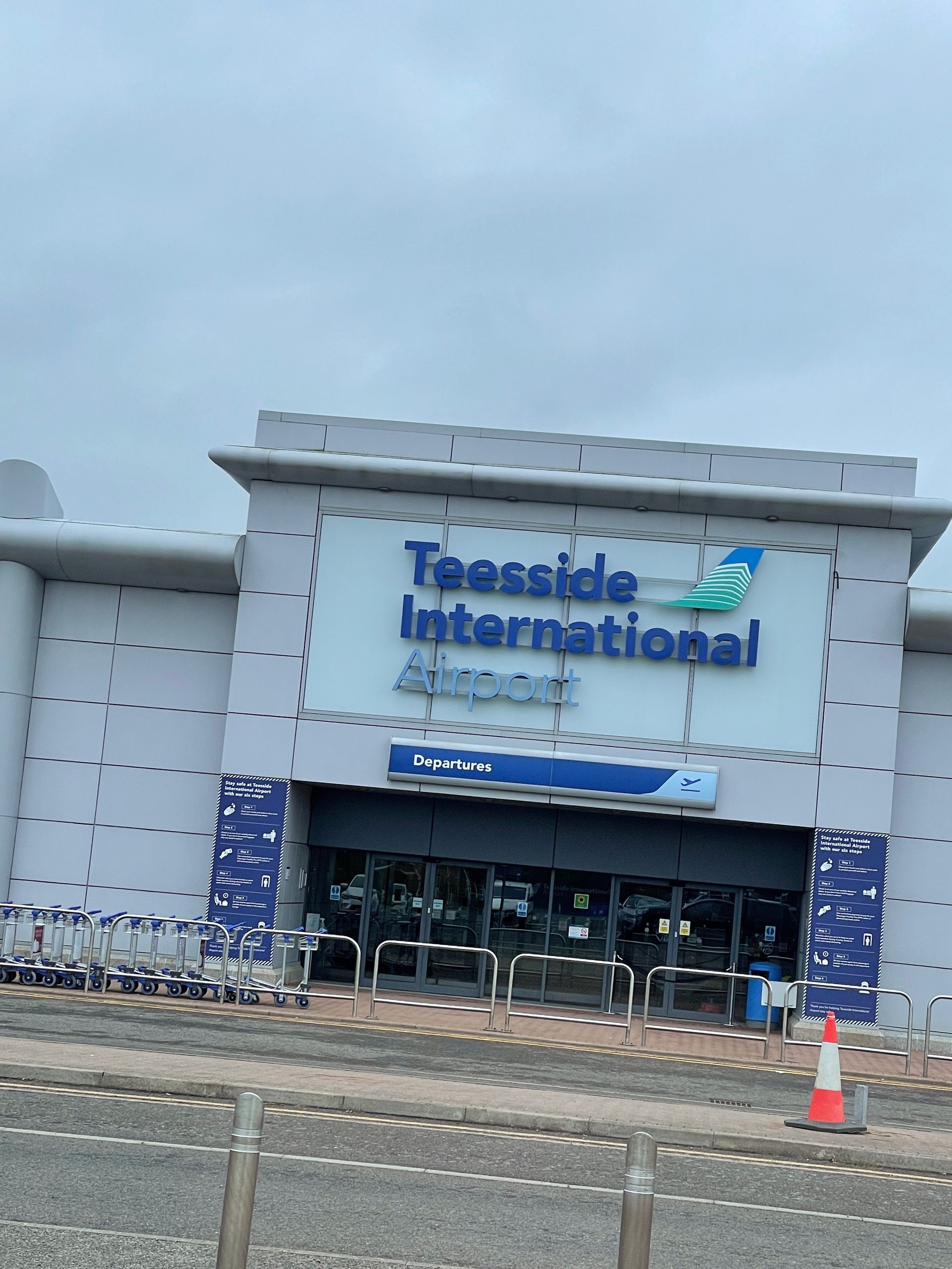 A large building with the words teesside international airport on it