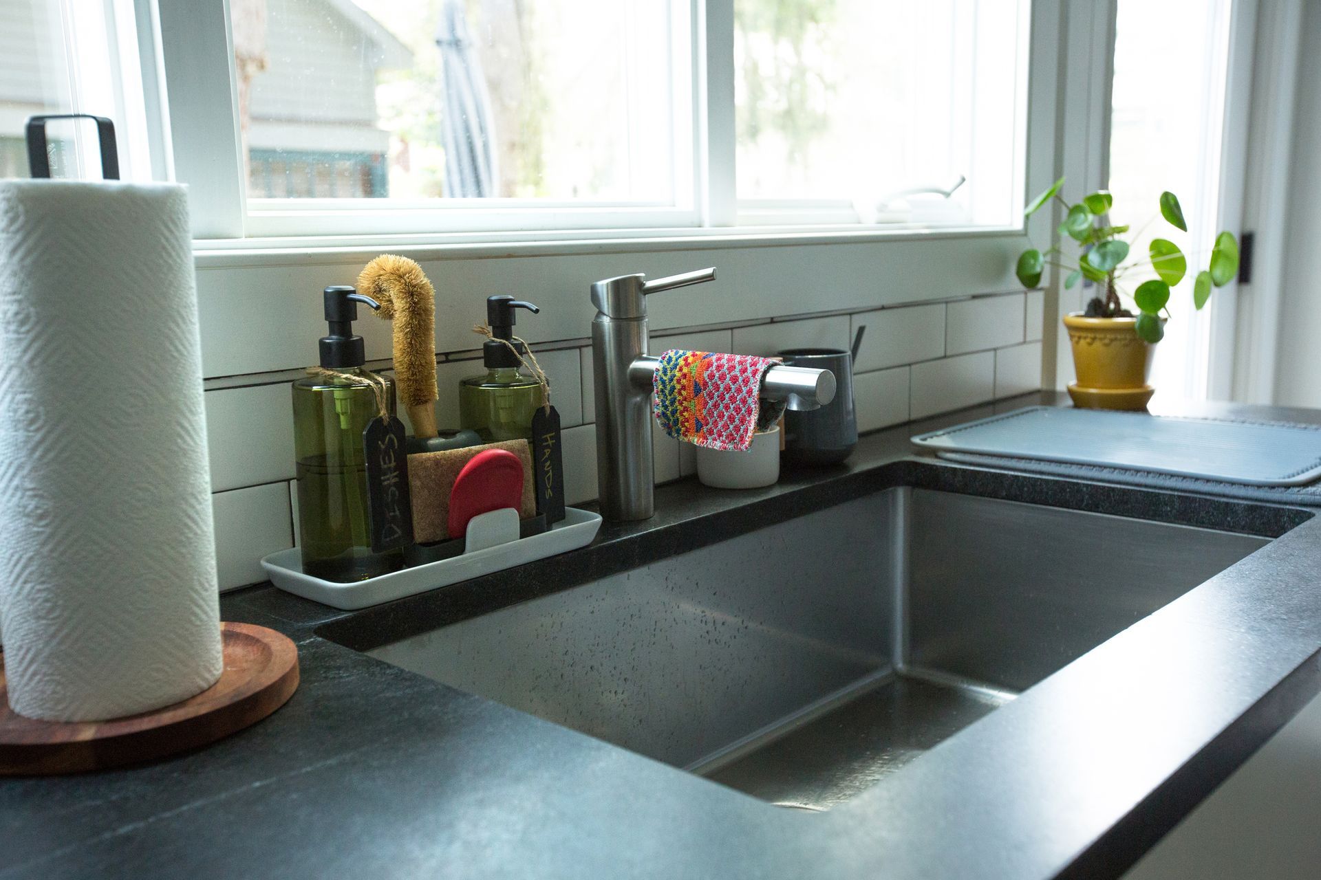 A Kitchen Sink With Soap Dispensers And A Paper Towel Holder | Clinton Township, MI | Touch of Class Cleaning