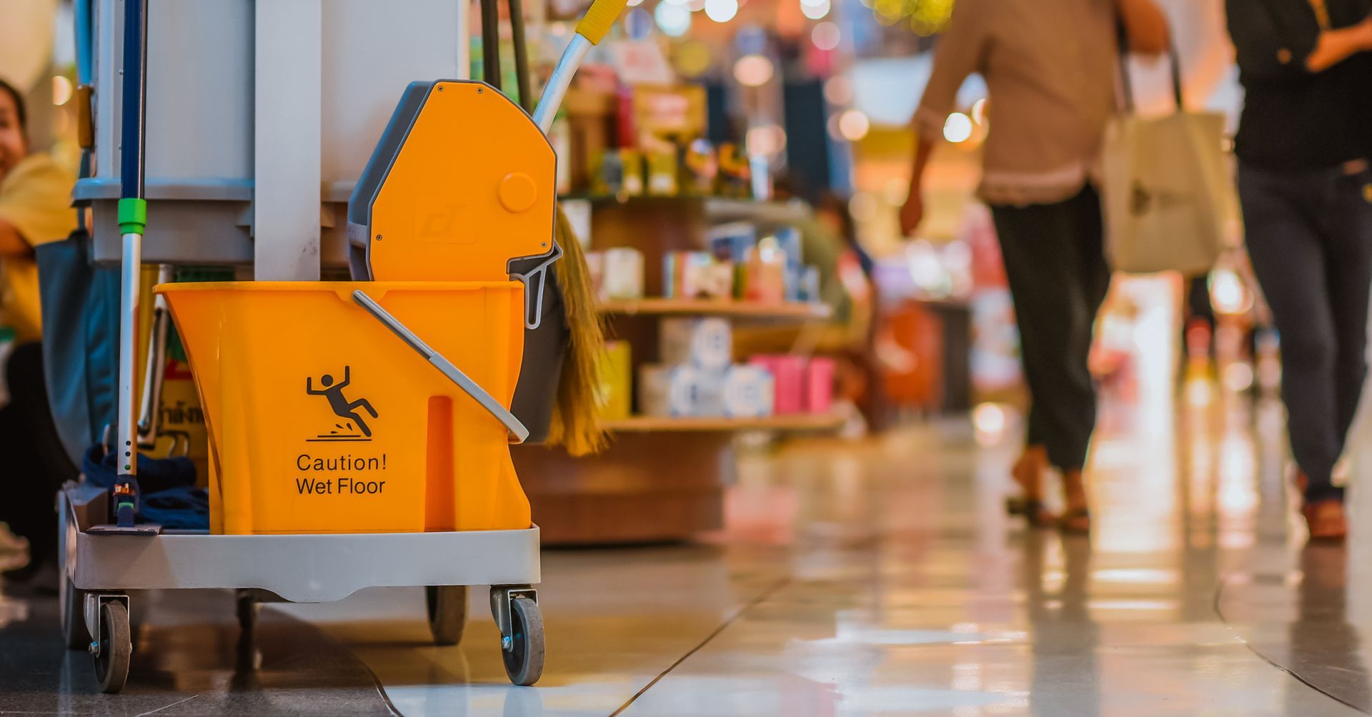 A Yellow Cleaning Cart With A Broom And Mop On It | Clinton Township, MI | Touch of Class Cleaning