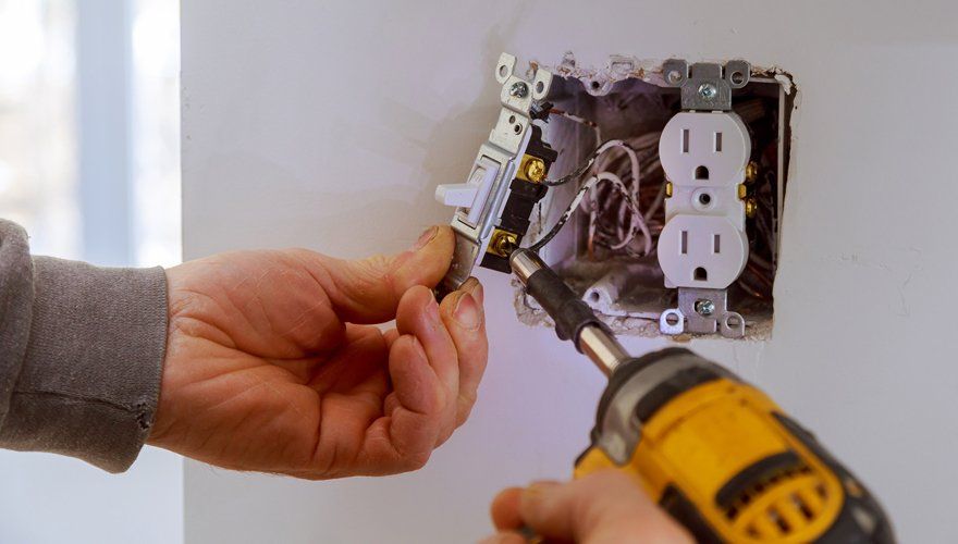 Electrician Installing A Power Switch — Kernersville, NC — Hodges Triad Electric Co LLC