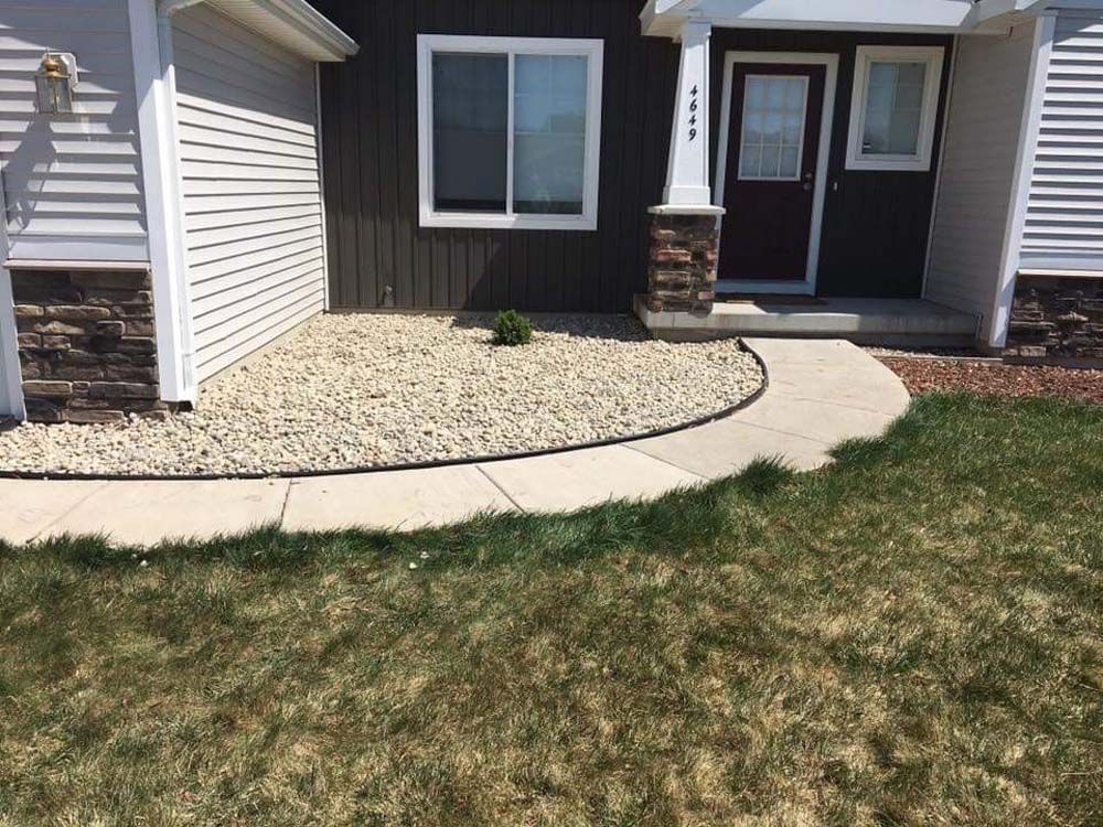 A House With a Walkway Leading to the Front Door