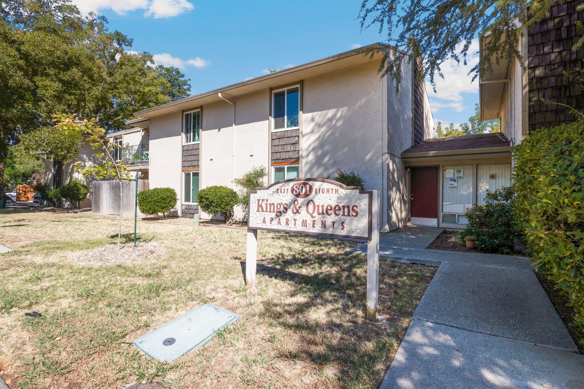 Exterior view of Kings and Queens Apartments building.