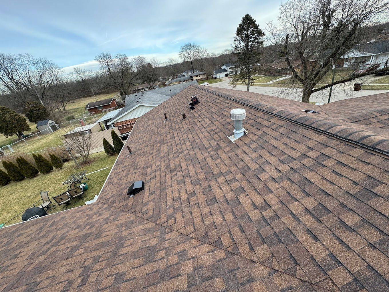 An aerial view of a roof with a chimney on it.