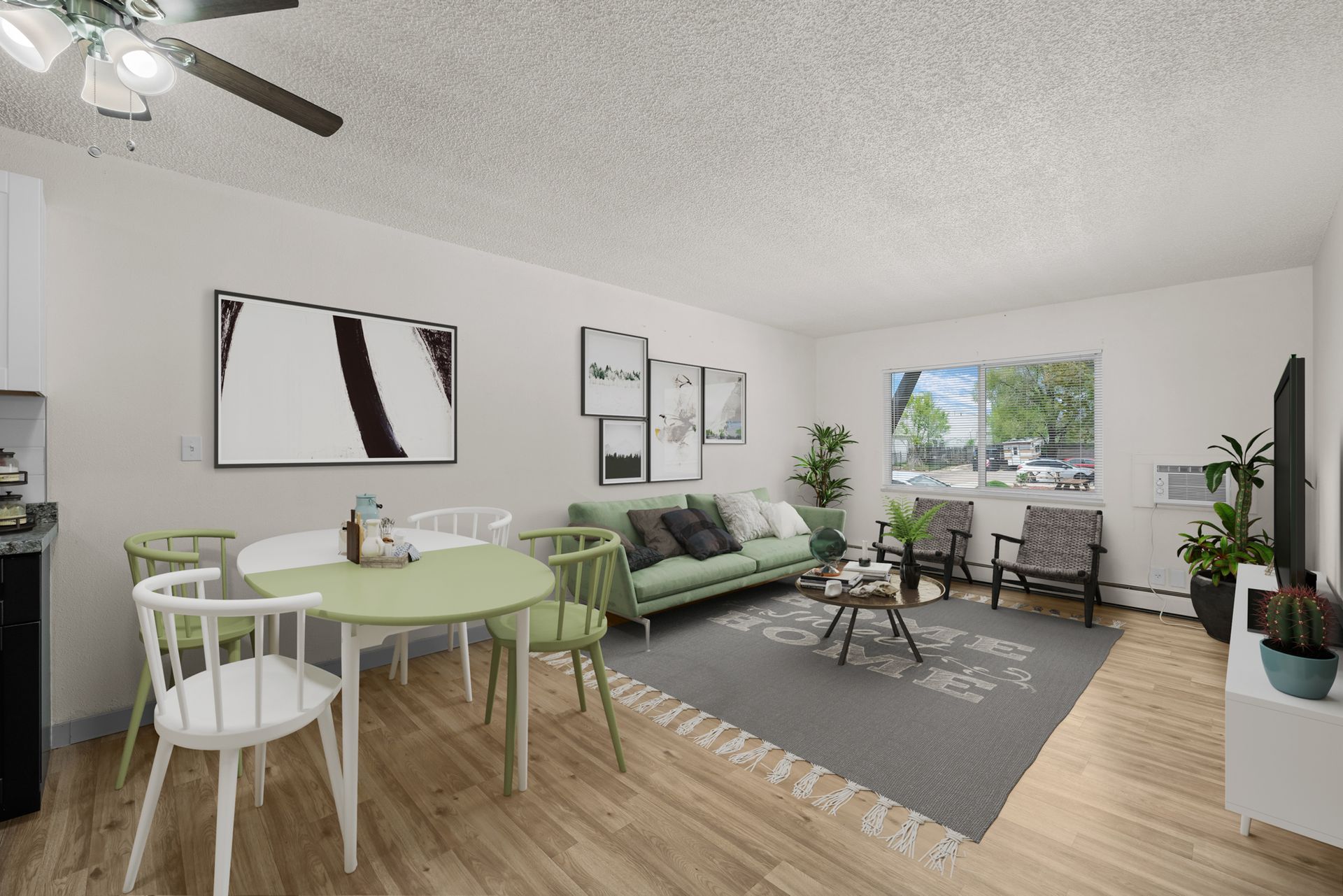 Photo showing a large living room with a wide window and a dining area space also available
