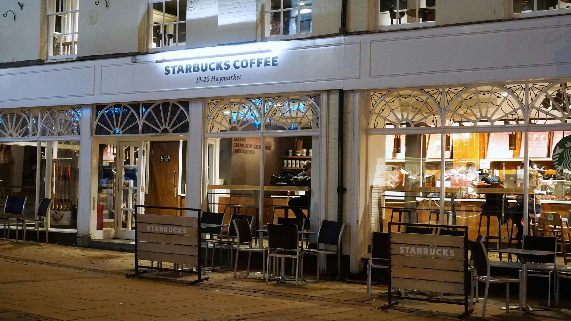 Starbucks Coffee shop with large storefront windows and entry doors