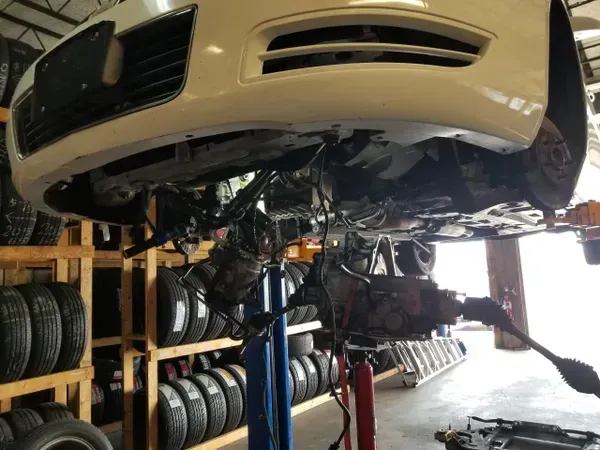 gallery car lifted up repair in progress | Precision Tires Auto