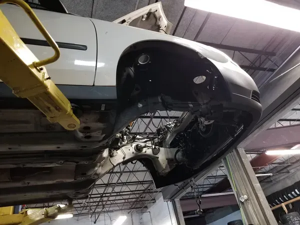 gallery car lifted up without wheels | Precision Tires Auto