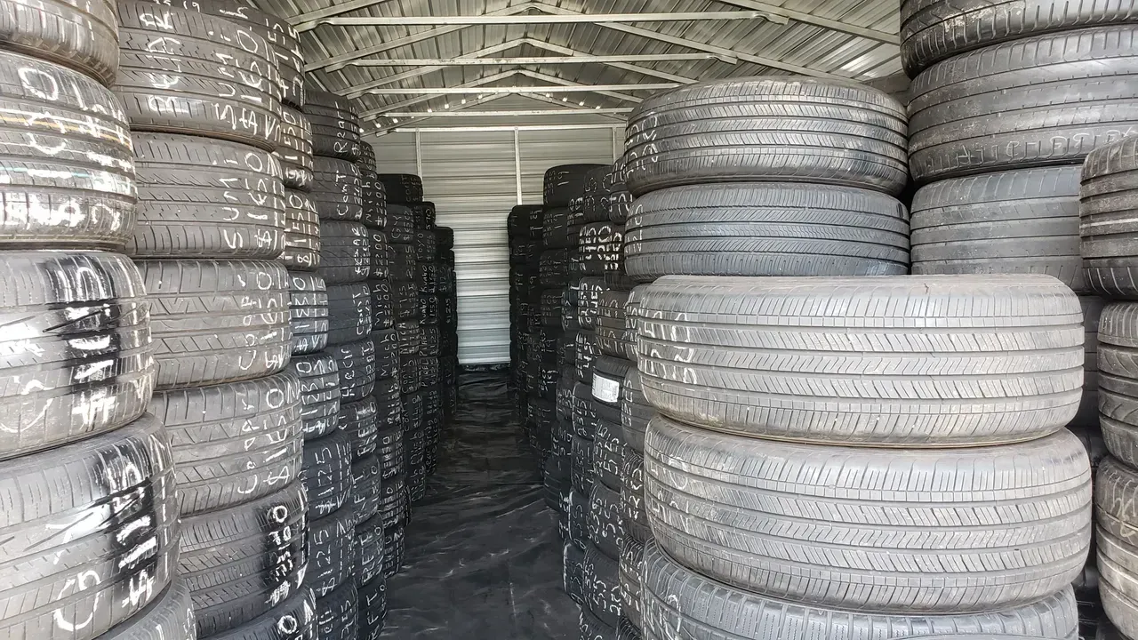 gallery garage full of tires stack | Precision Tires Auto