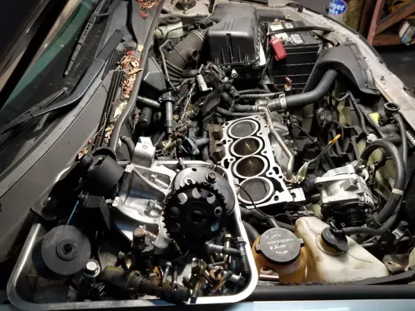 gallery hood up vehicle repair in process | Precision Tires Auto