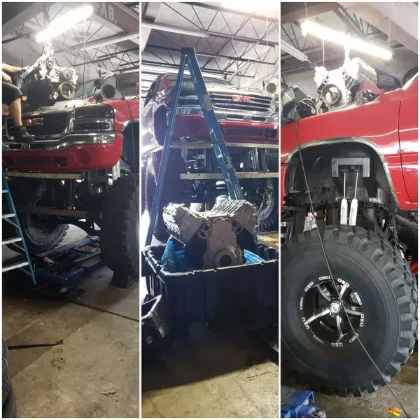 gallery red truck gmc in garage | Precision Tires Auto