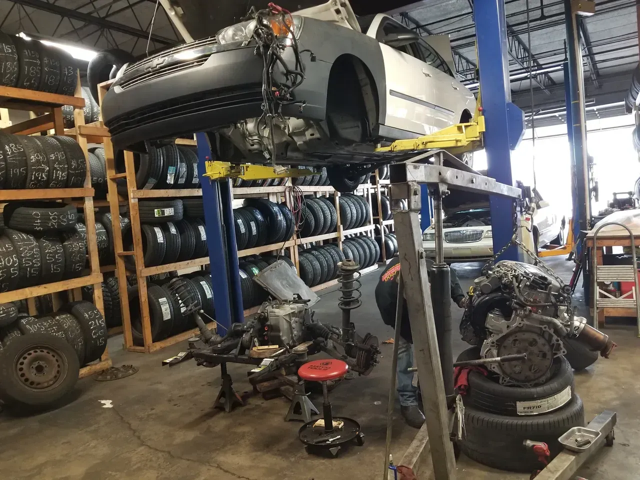 gallery repair in garage vehicle on lift | Precision Tires Auto