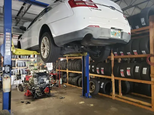 gallery white vehicle raised up | Precision Tires Auto