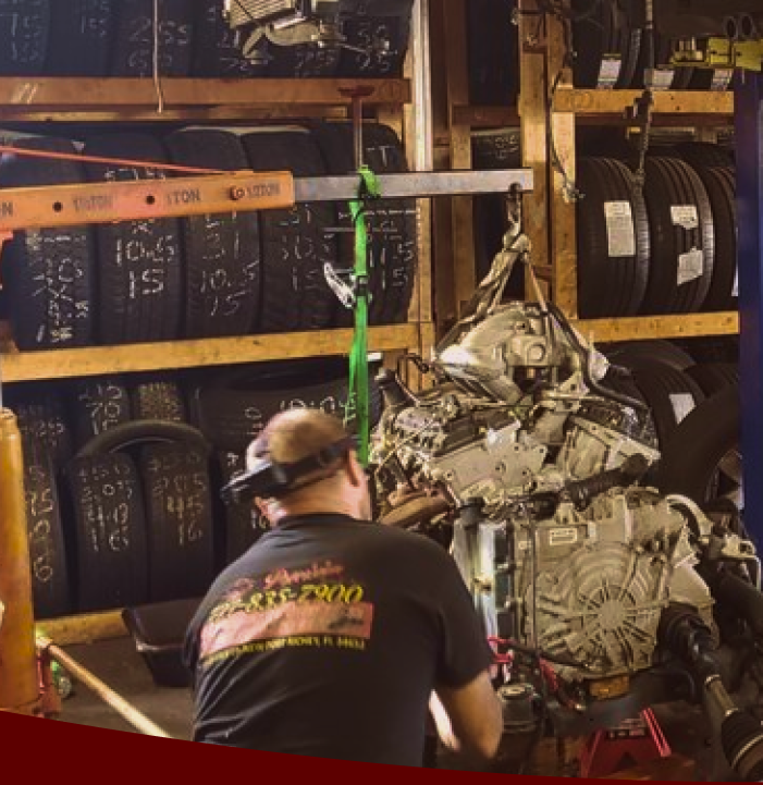 mechanic working on engine | Precision Tires Auto