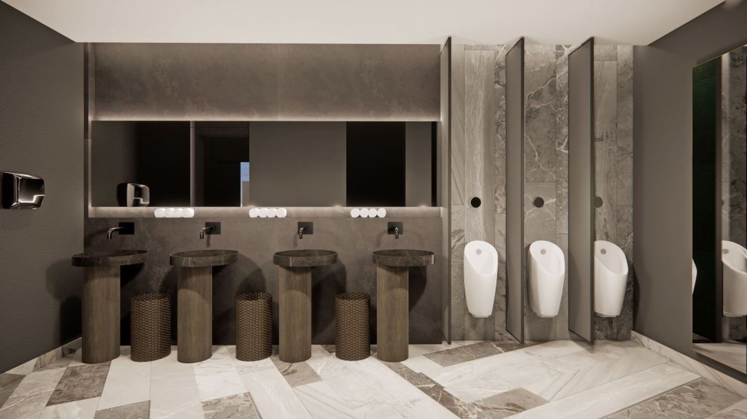 Modern public restroom with gray walls, sinks, and urinals.