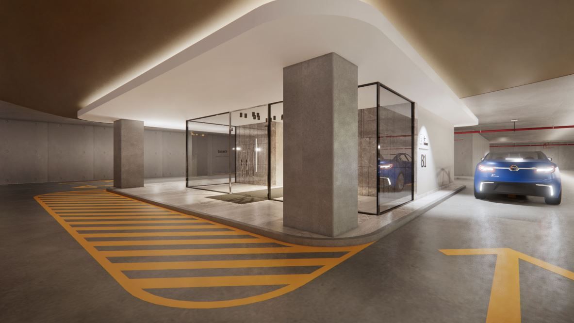 Modern parking garage with blue car approaching glass-enclosed display area; yellow striped lane; concrete pillars.