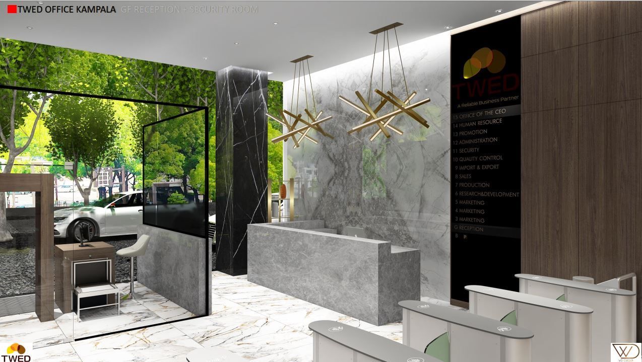Modern office lobby with a stone reception desk and a green wall.