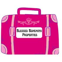 Pink suitcase graphic with “Blessed Bohemian Properties” logo on front