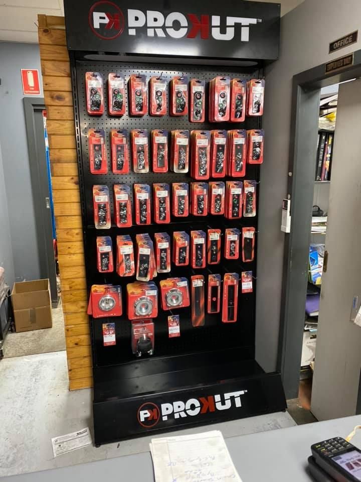 A shelf in a store with a price tag on it.