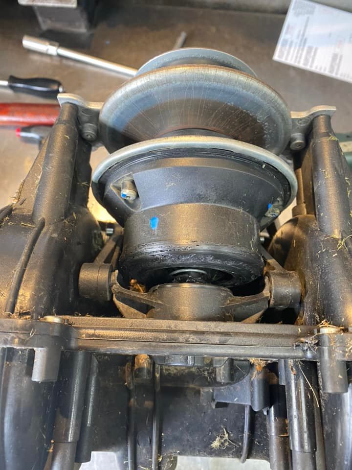 A close up of a machine with a screwdriver in the background.