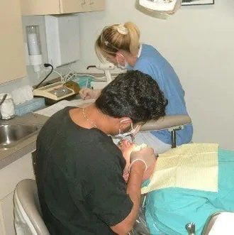 working on a patient. Chris Castellano DMD , top cosmetic   dentist , Riverview, Fl. 33578