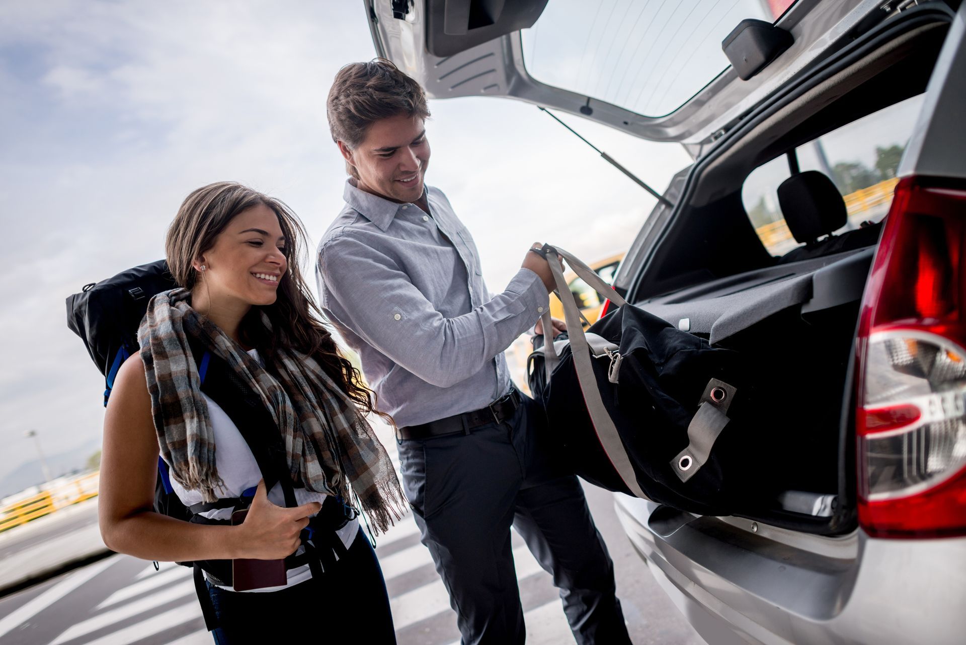Picture of Two Person Behind a Car | Topeka, KS | A&R Taxi Empire