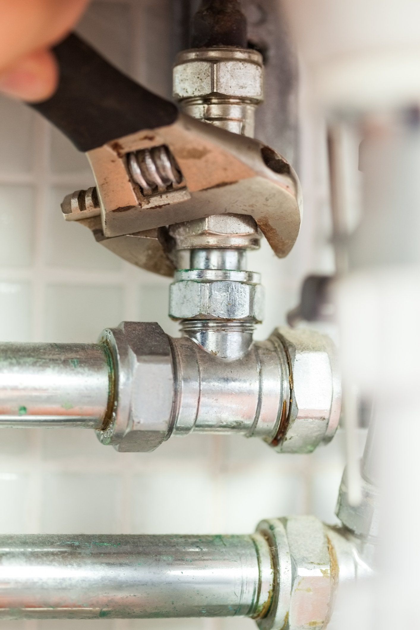 Checking Pipes With A Wrench — San Jose, CA — Alert Plumbing, Inc.