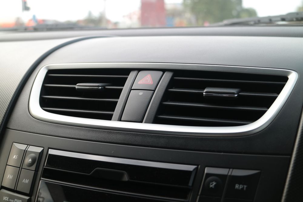 Car Dashboard Air Vents and Hazard Light Button in a Black and Silver Interior — Wingham Mechanical in Wingham, NSW
