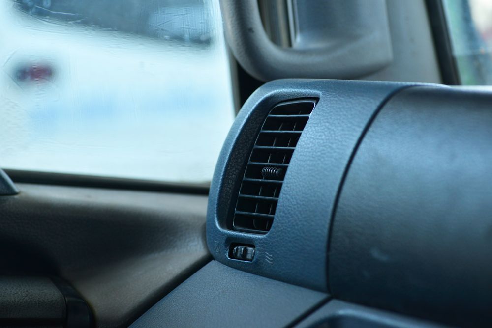 Close-up Of a Car Dashboard Air Vent and Glove Compartment in a Dark Interior — Wingham Mechanical in Wingham, NSW