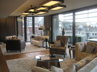 A living room with a lot of furniture and a large window