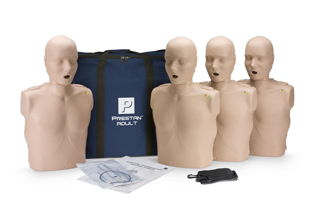 A group of mannequins are sitting next to each other in front of a blue bag — First Aid Training in Mackay,QLD