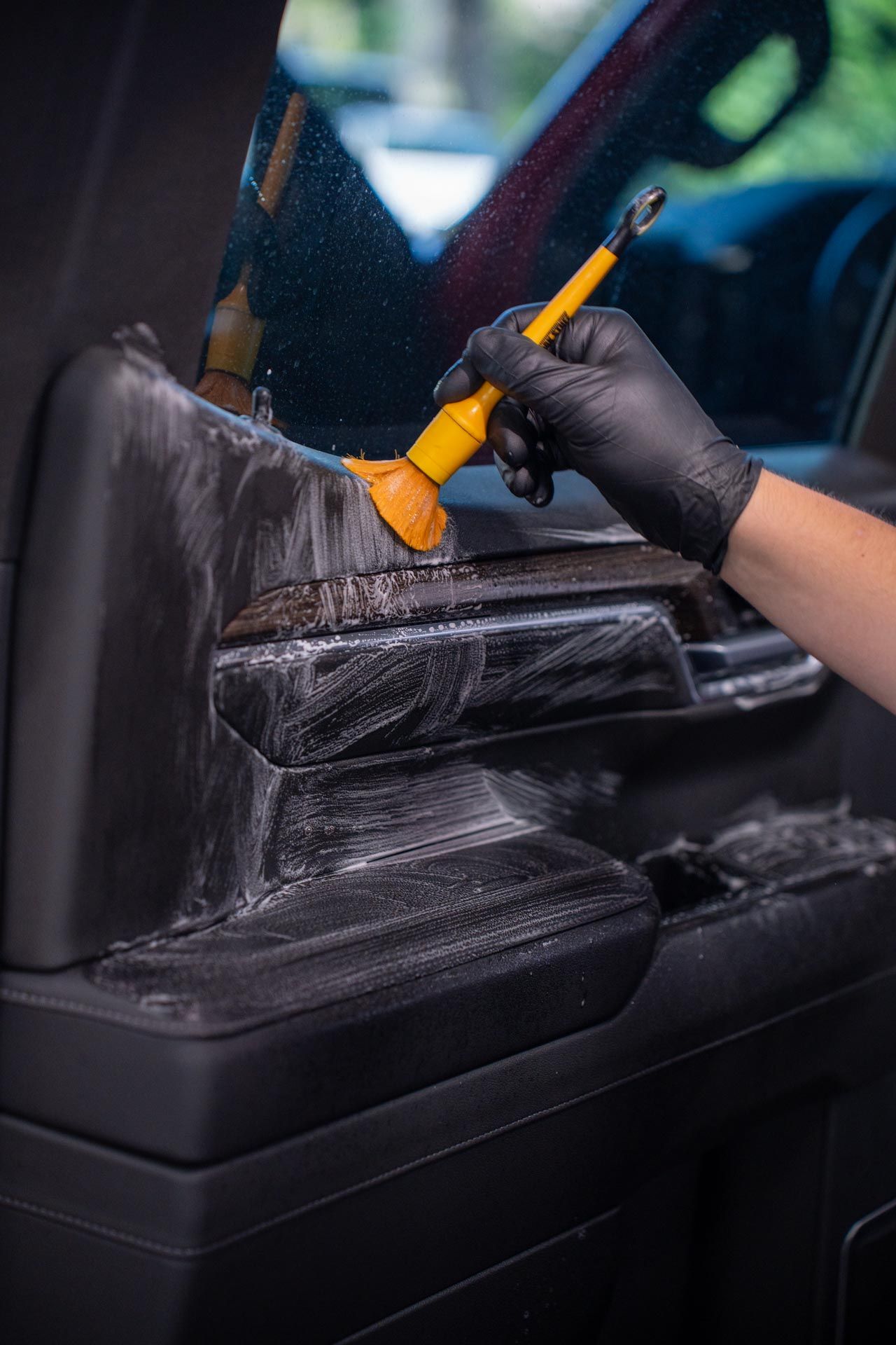 A blue Honda Civic Si parked in a dimly lit indoor parking garage.