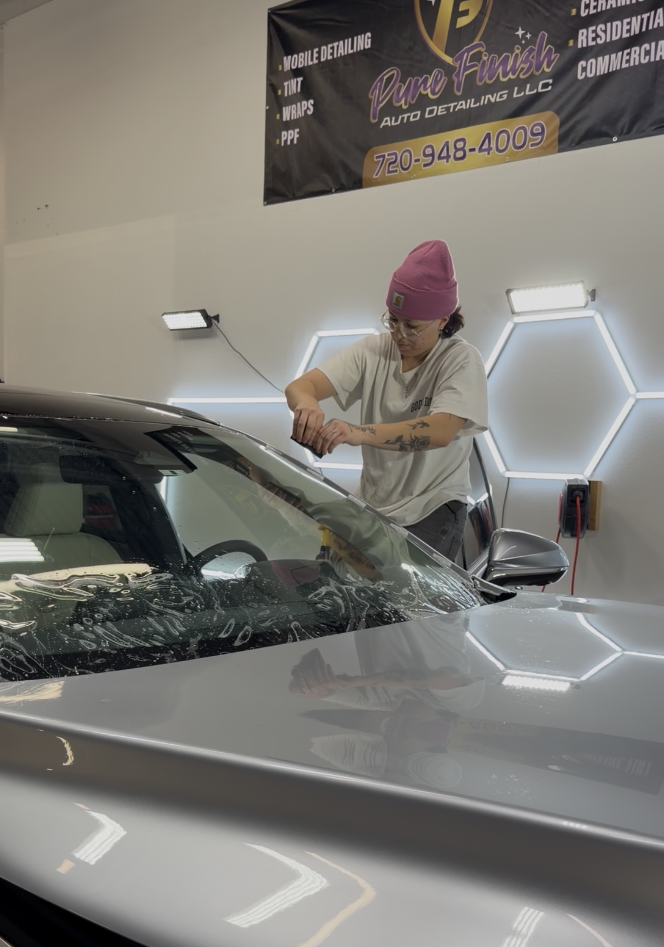 A yellow and white sports car on a black background.