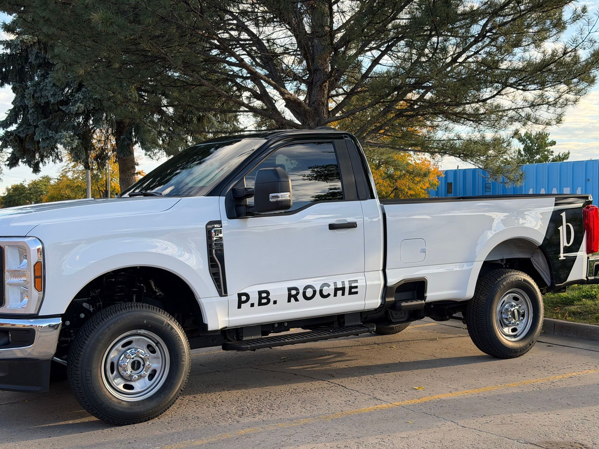 A white Ford pickup truck with 