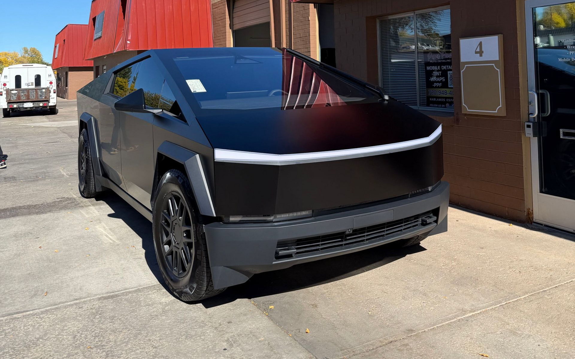 A yellow and white sports car on a black background.