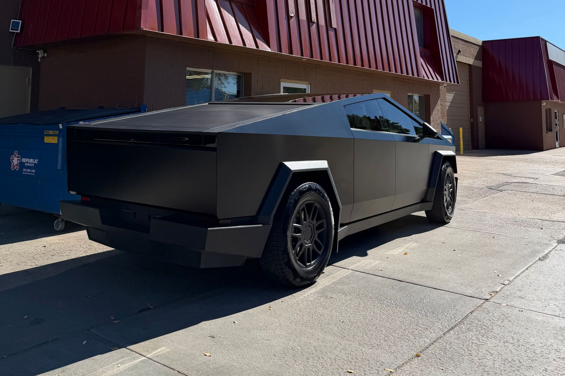 A yellow and white sports car on a black background.