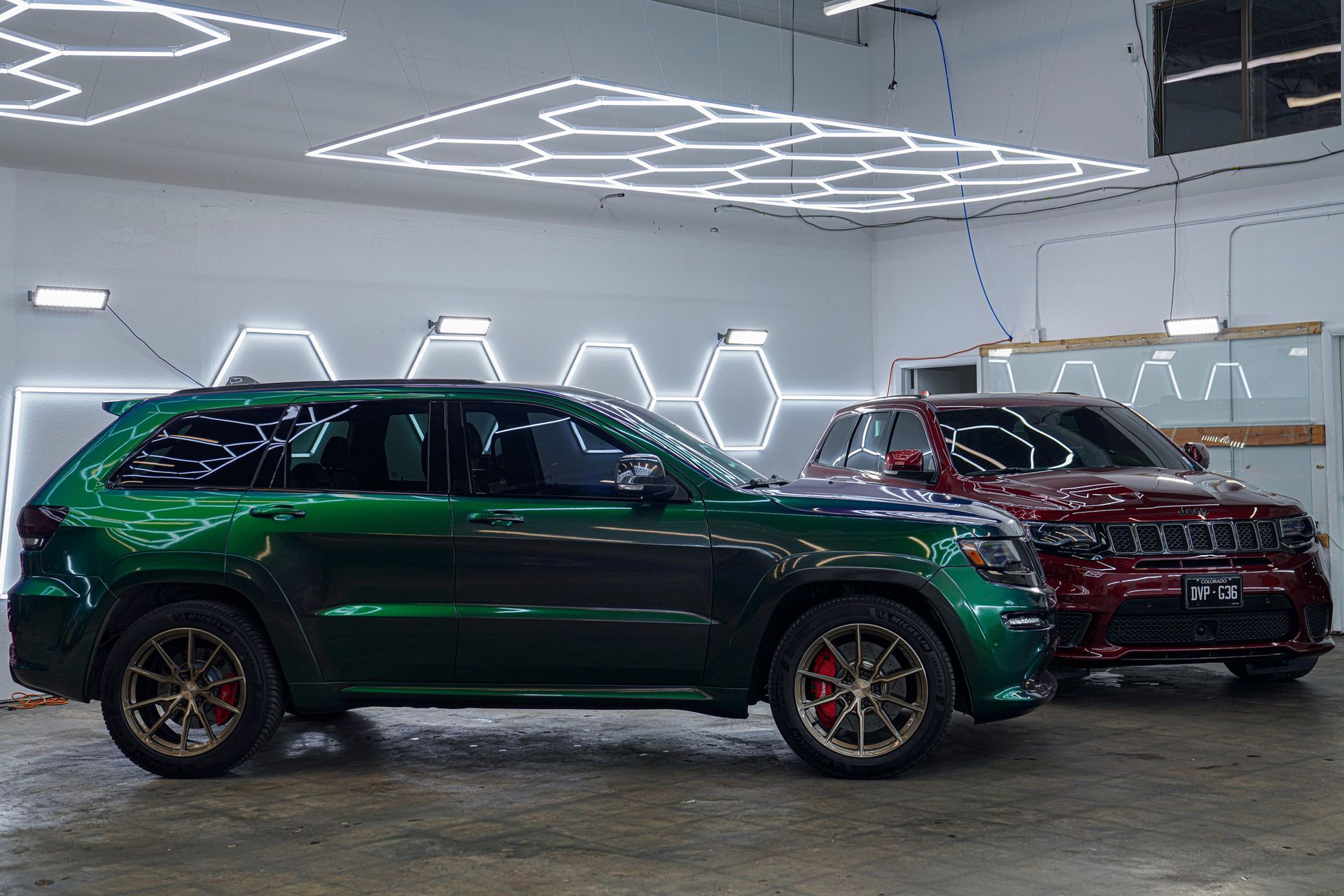 A yellow and white sports car on a black background.