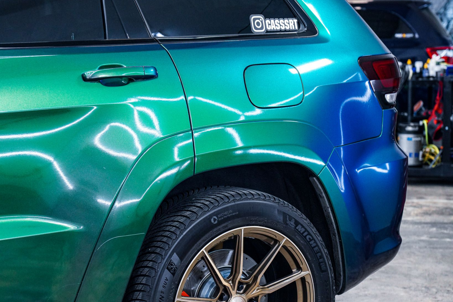 A yellow and white sports car on a black background.