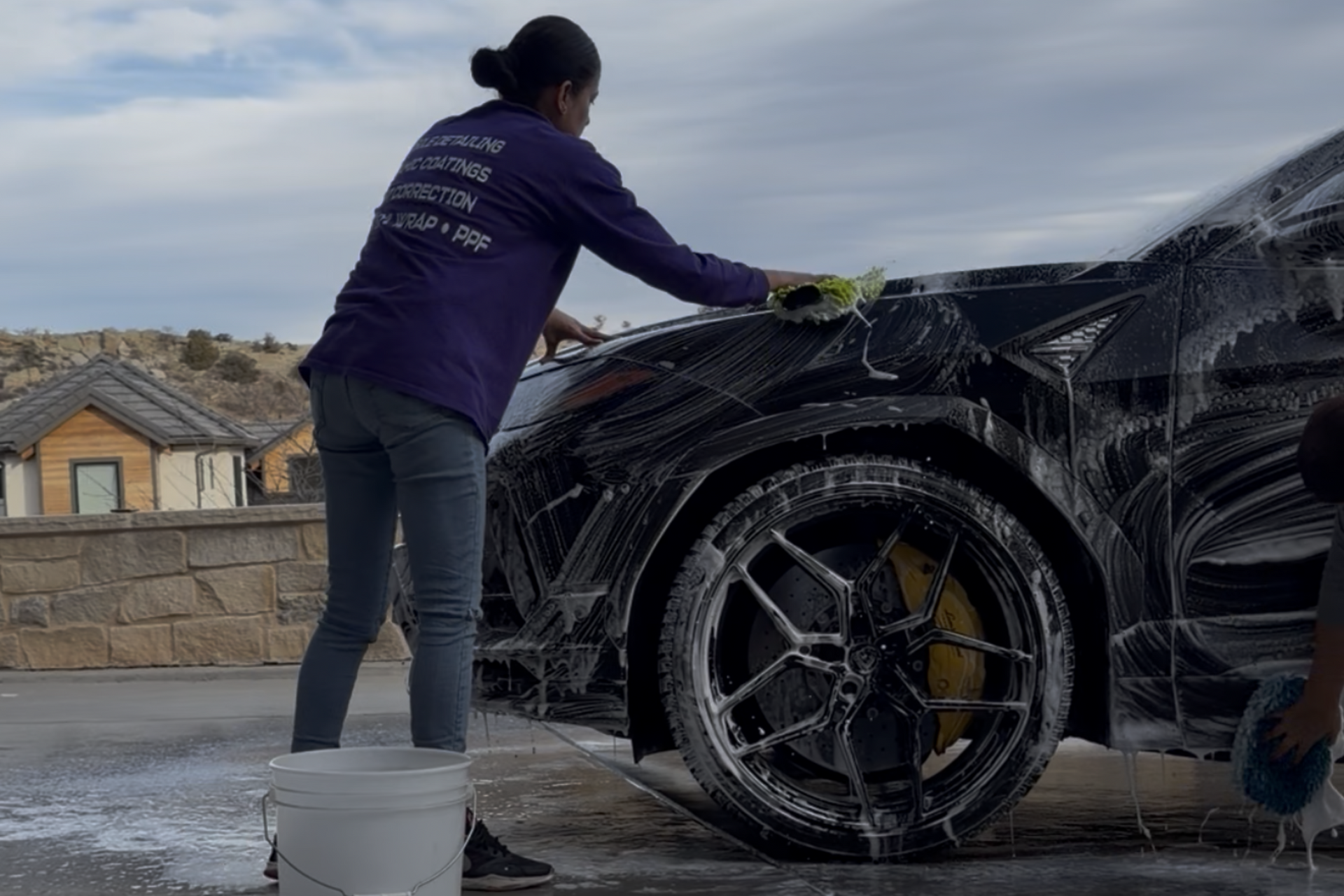 A white and yellow sports car on a black background.