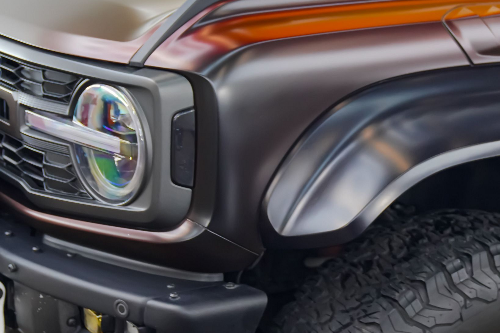 A yellow and white sports car on a black background.