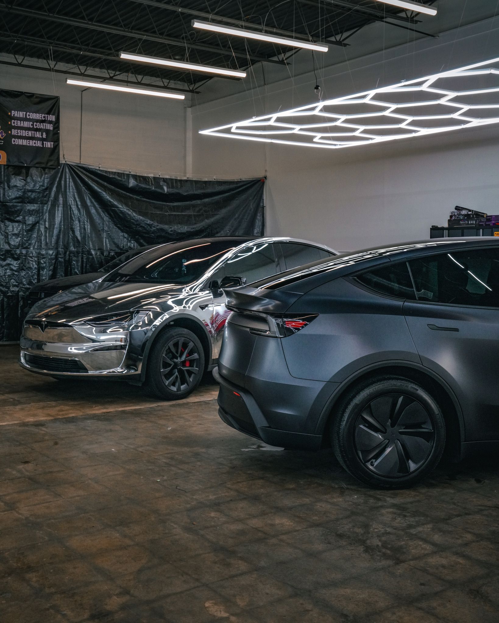 A yellow and white sports car on a black background.