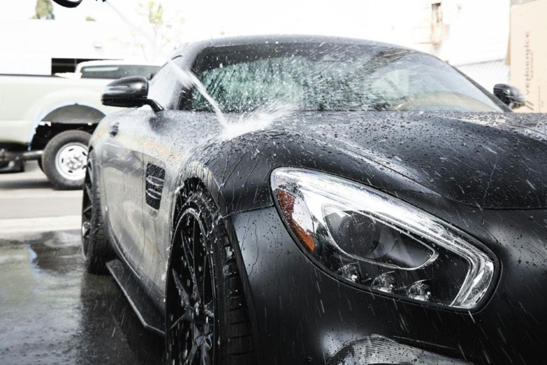 A yellow and white sports car on a black background.